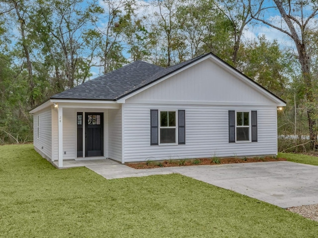 rear view of house with a yard