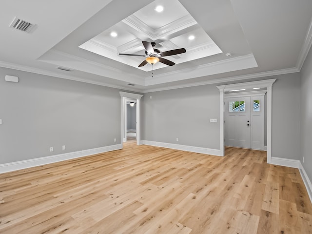 spare room featuring crown molding, ceiling fan, coffered ceiling, and light hardwood / wood-style floors