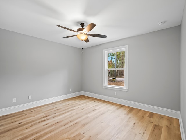 unfurnished room with ceiling fan and light wood-type flooring