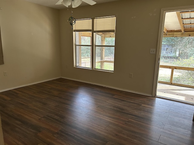 unfurnished room featuring ceiling fan, plenty of natural light, and dark hardwood / wood-style floors