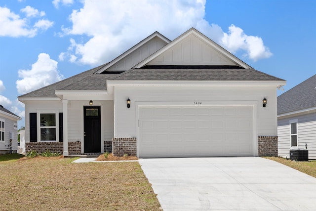 craftsman inspired home featuring central AC, a front lawn, and a garage