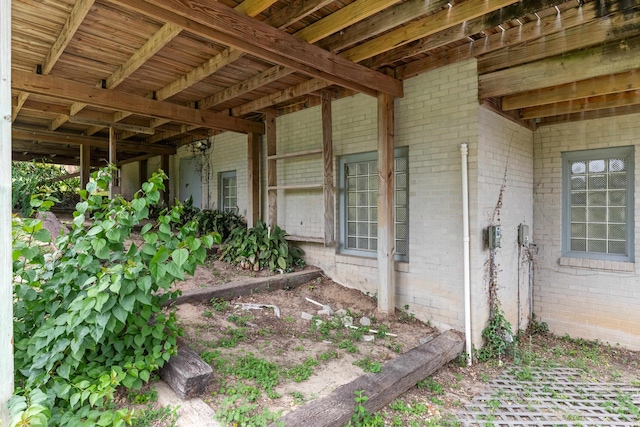 186 NW Whispering Pines Loop, Madison, FL 32340 - view of exterior entry featuring brick siding