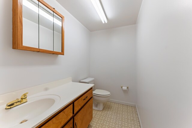 186 NW Whispering Pines Loop, Madison, FL 32340 - bathroom featuring vanity, toilet, and tile patterned floors