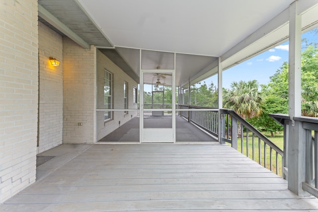 186 NW Whispering Pines Loop, Madison, FL 32340 - wooden deck featuring a sunroom