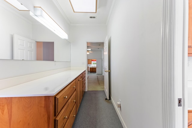 186 NW Whispering Pines Loop, Madison, FL 32340 - corridor with baseboards, dark carpet, ornamental molding, and visible vents