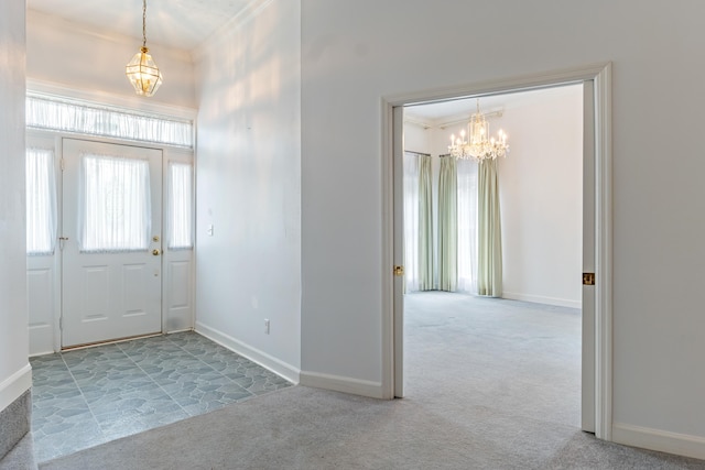 186 NW Whispering Pines Loop, Madison, FL 32340 - carpeted foyer with crown molding, a notable chandelier, and baseboards