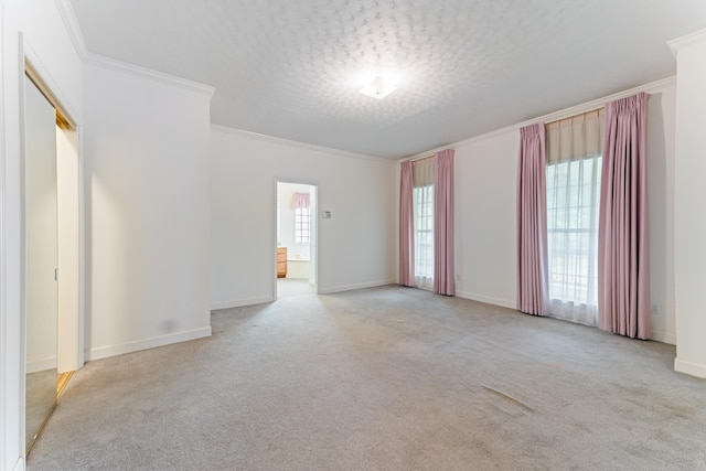 186 NW Whispering Pines Loop, Madison, FL 32340 - spare room featuring baseboards, carpet flooring, and crown molding