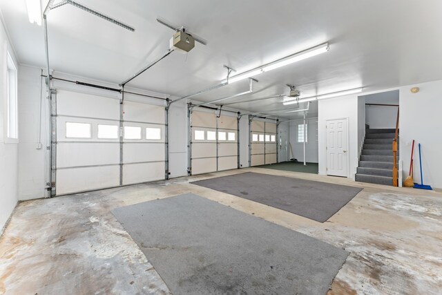186 NW Whispering Pines Loop, Madison, FL 32340 - garage featuring a garage door opener