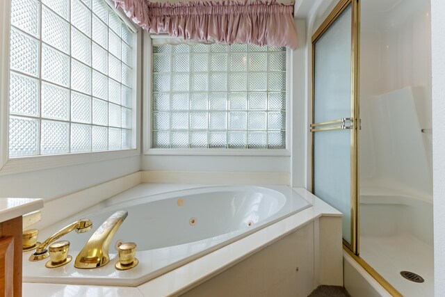186 NW Whispering Pines Loop, Madison, FL 32340 - full bath featuring a whirlpool tub and a shower stall