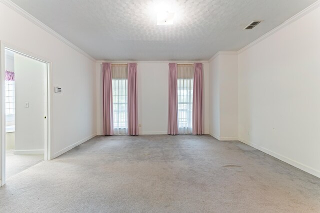 186 NW Whispering Pines Loop, Madison, FL 32340 - carpeted empty room featuring crown molding, a textured ceiling, visible vents, and baseboards