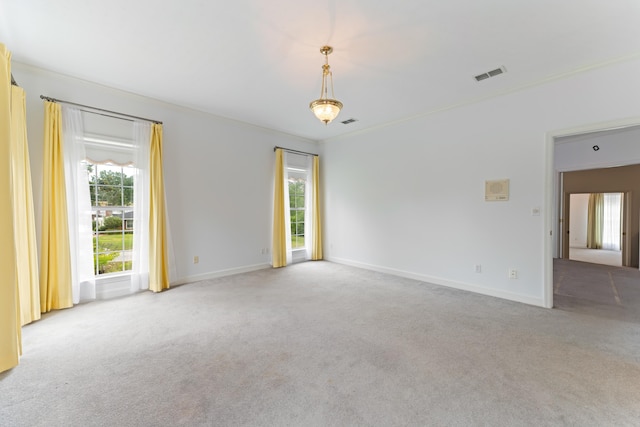 186 NW Whispering Pines Loop, Madison, FL 32340 - carpeted spare room featuring crown molding, visible vents, and baseboards
