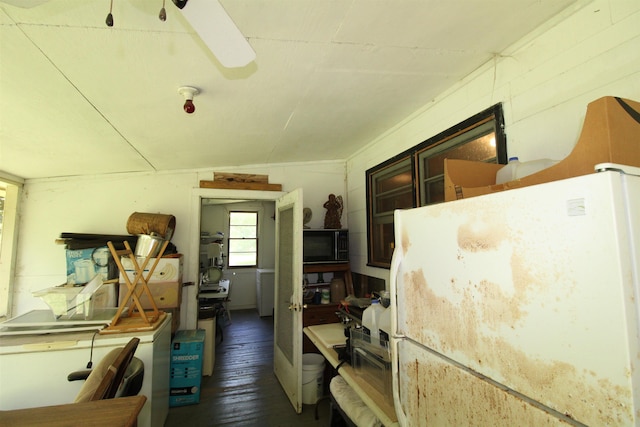 30 Ace High Ln, Crawfordville, FL 32327 - kitchen with freestanding refrigerator, black microwave, and wood finished floors