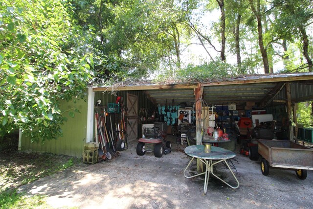 30 Ace High Ln, Crawfordville, FL 32327 - view of patio with a pole building and an outbuilding