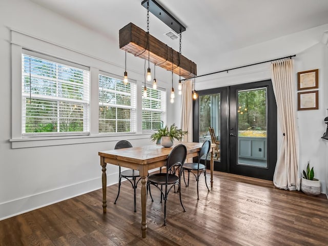 dining area featuring french doors and dark hardwood / wood-style floors