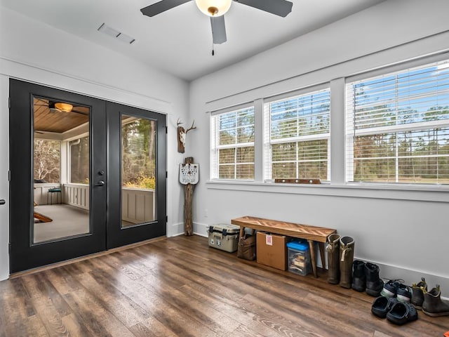 doorway with french doors, ceiling fan, and dark hardwood / wood-style floors