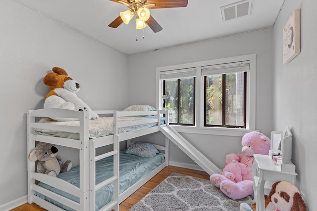 bedroom featuring hardwood / wood-style flooring and ceiling fan