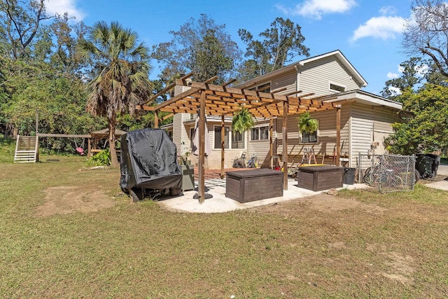 back of property featuring a patio, a pergola, and a yard