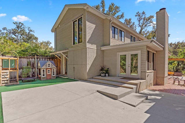 rear view of property with a patio and french doors