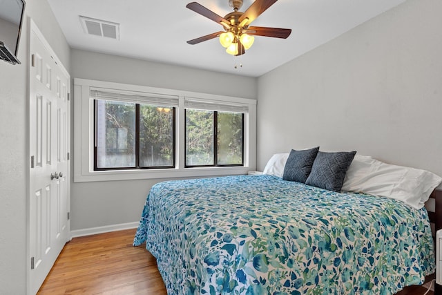 bedroom featuring ceiling fan and light hardwood / wood-style flooring