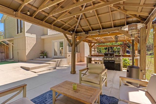 view of patio / terrace featuring exterior kitchen and a grill