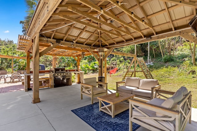 view of patio featuring an outdoor living space, grilling area, and a gazebo