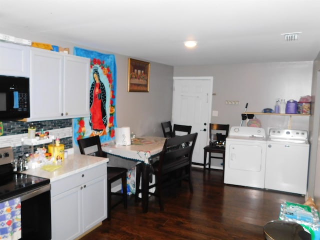 287 Tyre Rd, Havana, FL 32333 - kitchen featuring stainless steel electric range, washer and clothes dryer, black microwave, decorative backsplash, and dark wood-style flooring