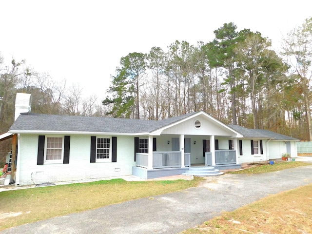 287 Tyre Rd, Havana, FL 32333 - ranch-style home with a porch, brick siding, a chimney, and roof with shingles