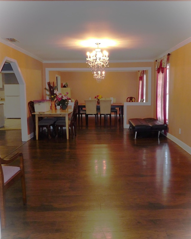 287 Tyre Rd, Havana, FL 32333 - dining area with a chandelier, ornamental molding, wood finished floors, and arched walkways