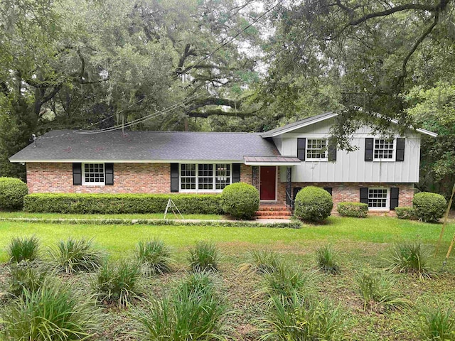 tri-level home with a front yard