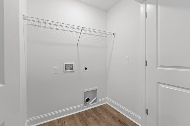 laundry room with wood-type flooring, hookup for a washing machine, and hookup for an electric dryer