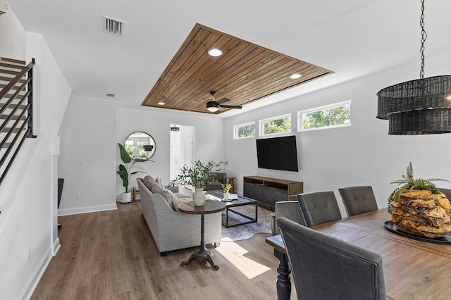 living room with wooden ceiling, hardwood / wood-style flooring, and ceiling fan