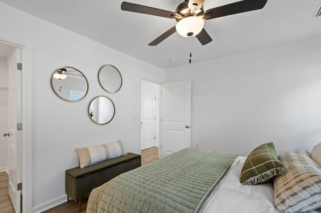 bedroom featuring hardwood / wood-style flooring and ceiling fan