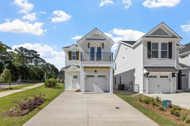 view of front of property featuring a garage, central AC, a front yard, and a balcony