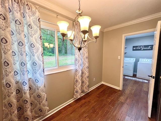2401 Mexia Ave, Tallahassee, FL 32304 - unfurnished dining area with washer and clothes dryer, a chandelier, wood finished floors, ornamental molding, and baseboards