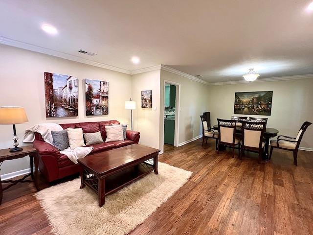 2401 Mexia Ave, Tallahassee, FL 32304 - living room with wood finished floors, crown molding, baseboards, and recessed lighting