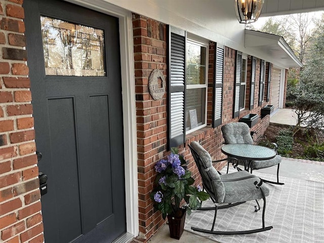 2401 Mexia Ave, Tallahassee, FL 32304 - view of exterior entry featuring brick siding and covered porch
