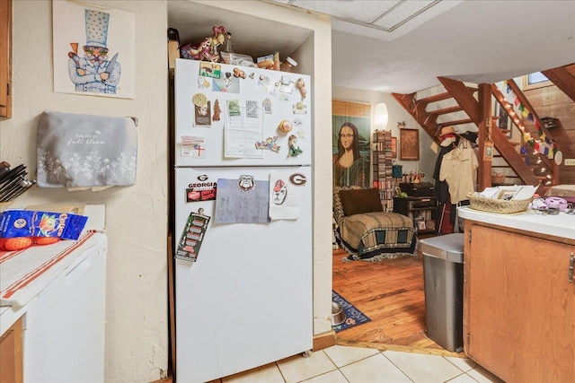 1292 Rumba Ln -, Unit Tallahassee, FL 32304 - kitchen featuring freestanding refrigerator, light tile patterned floors, and light countertops