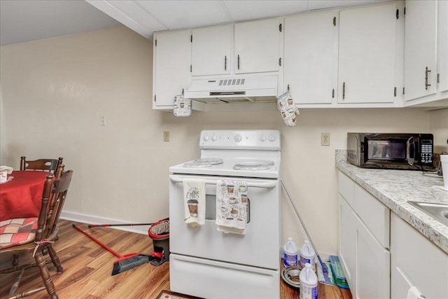 1292 Rumba Ln -, Unit Tallahassee, FL 32304 - kitchen featuring electric range, under cabinet range hood, black microwave, light wood-style flooring, and white cabinets