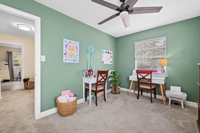 recreation room featuring a ceiling fan, carpet flooring, and baseboards