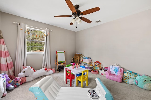 playroom with a ceiling fan, visible vents, and carpet flooring