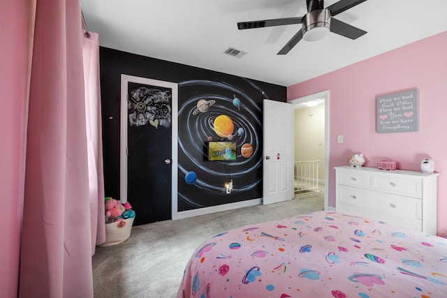 carpeted bedroom with visible vents and a ceiling fan