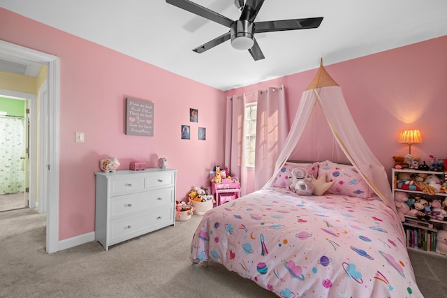 bedroom with light carpet, a ceiling fan, and baseboards