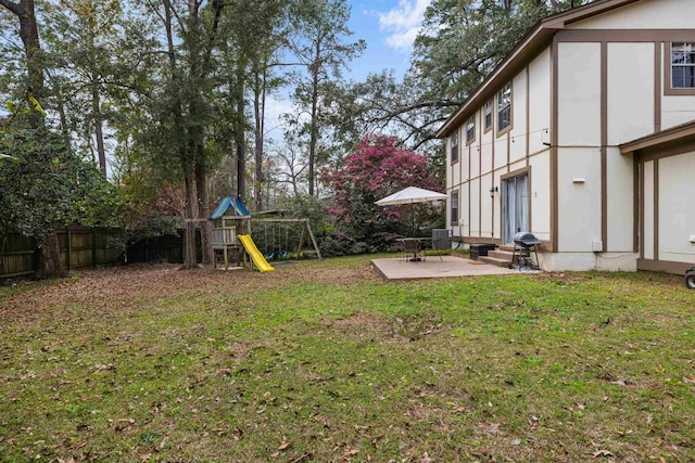 view of yard featuring a playground, a patio, entry steps, fence, and cooling unit