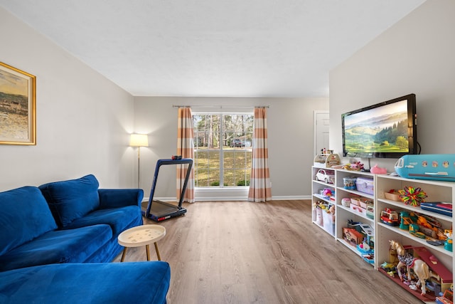 living room featuring baseboards and wood finished floors