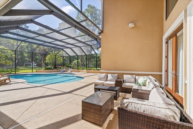 8017 Oak Grove Plantation Rd, Tallahassee, FL 32312 - swimming pool featuring a patio area, an outdoor living space, and glass enclosure