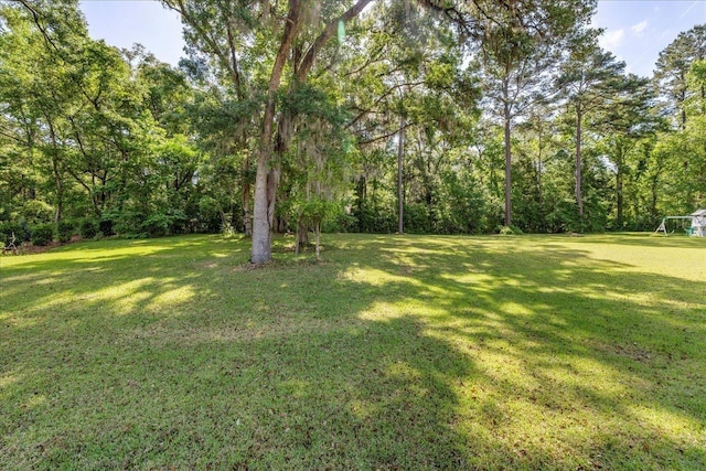 8017 Oak Grove Plantation Rd, Tallahassee, FL 32312 - view of grassy yard with a view of trees