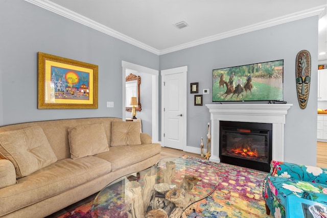 living room with ornamental molding and wood-type flooring