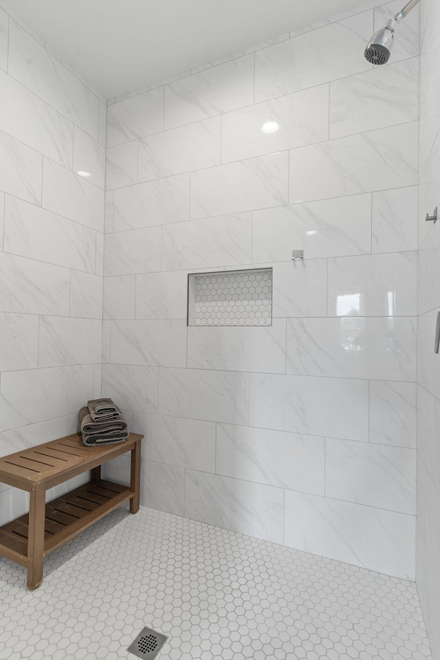 bathroom with tiled shower