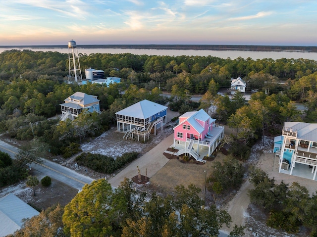 aerial view at dusk with a water view