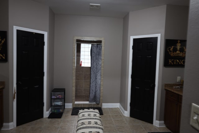 325 Mine Rd, Midway, FL 32343 - tiled foyer entrance with baseboards